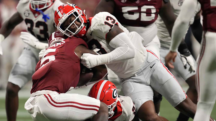 Dec 2, 2023; Atlanta, GA, USA; Georgia Bulldogs defensive lineman Mykel Williams (13) tackles Alabama Crimson Tide running back Roydell Williams (5) during the second half in the SEC Championship game at Mercedes-Benz Stadium. Mandatory Credit: Dale Zanine-Imagn Images Dec 2, 2023; Atlanta, GA, USA; Georgia Bulldogs defensive lineman Mykel Williams (13) tackles Alabama Crimson Tide running back Roydell Williams (5) during the second half in the SEC Championship game at Mercedes-Benz Stadium. Mandatory Credit: Dale Zanine-Imagn Images