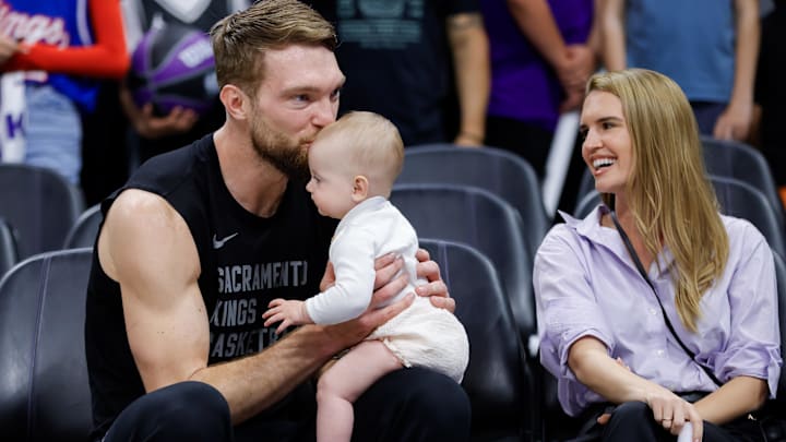 Apr 2, 2024; Sacramento, California, USA; Sacramento Kings forward Domantas Sabonis (10) kisses his daughter Eleven in the forehead before a game against the New Orleans Pelicans at Golden 1 Center. Mandatory Credit: Sergio Estrada-Imagn Images