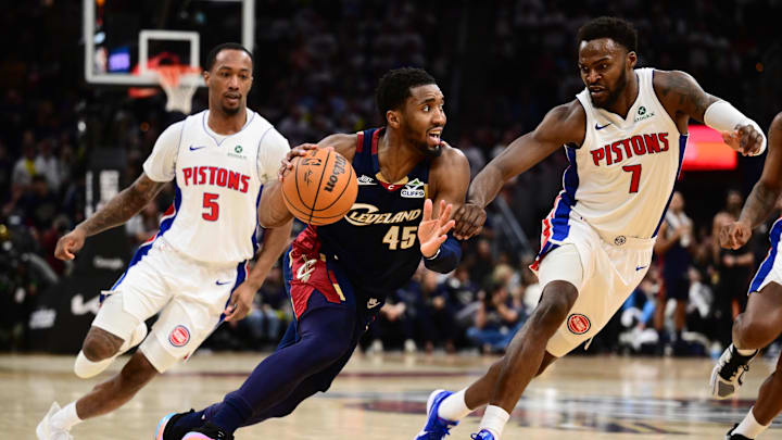 May 11, 2026; Cleveland, Ohio, USA; Cleveland Cavaliers guard Donovan Mitchell (45) drives to the basket against Detroit Pistons forward Paul Reed (7) and forward Ronald Holland II (5) during the second half of game four in the second round of the 2026 NBA Playoffs at Rocket Arena. Mandatory Credit: Ken Blaze-Imagn Images May 11, 2026; Cleveland, Ohio, USA; Cleveland Cavaliers guard Donovan Mitchell (45) drives to the basket against Detroit Pistons forward Paul Reed (7) and forward Ronald Holland II (5) during the second half of game four in the second round of the 2026 NBA Playoffs at Rocket Arena. Mandatory Credit: Ken Blaze-Imagn Images