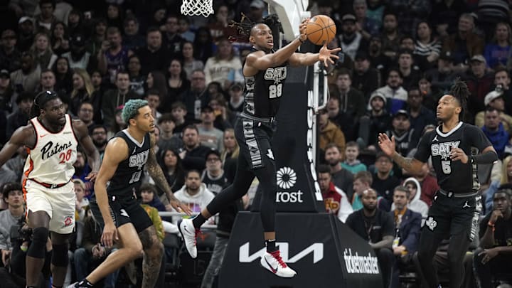 Feb 21, 2025; Austin, Texas, USA; San Antonio Spurs center Charles Bassey (28) reaches for a rebound over teammates forward Jeremy Sochan (10) and guard Stephon Castle (5) and Detroit Pistons forward Isaiah Stewart (28) during the first half at Moody Center. Mandatory Credit: Scott Wachter-Imagn Images