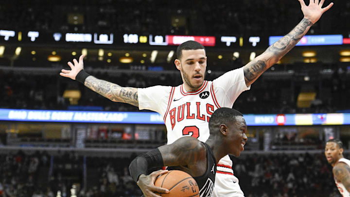 Dec 2, 2024; Chicago, Illinois, USA; Chicago Bulls guard Lonzo Ball (2) guards Brooklyn Nets guard Dennis Schroder (17) during the second half at the United Center. Mandatory Credit: Matt Marton-Imagn Images