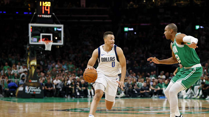 Jun 17, 2024; Boston, Massachusetts, USA; Dallas Mavericks guard Dante Exum (0) dribbles the ball against Boston Celtics center Al Horford (42) during the second quarter in game five of the 2024 NBA Finals at TD Garden. Mandatory Credit: Peter Casey-Imagn Images