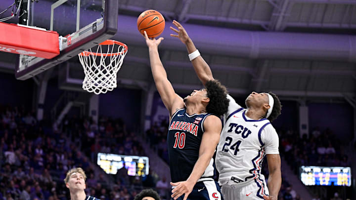 Jan 10, 2026; Fort Worth, Texas, USA; Arizona Wildcats forward Koa Peat (10) drives to the basket past TCU Horned Frogs forward Xavier Edmonds (24) during the second half at the Ed and Rae Schollmaier Arena. Mandatory Credit: Jerome Miron-Imagn Images