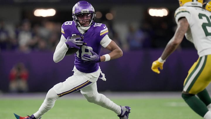Minnesota Vikings wide receiver Justin Jefferson (18) looks for running room after a reception during the third quarter of their game Sunday, December 29, 2024 at U.S. Bank Stadium in Minneapolis, Minnesota. The Minnesota Vikings beat the Green Bay Packers 27-25.