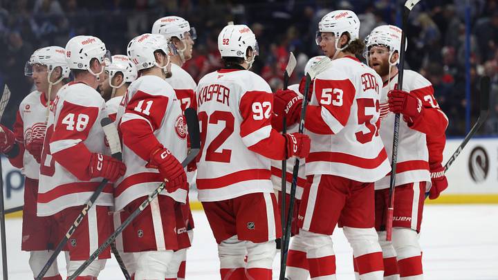 Apr 11, 2025; Tampa, Florida, USA; Detroit Red Wings right wing Vladimir Tarasenko (11), center Marco Kasper (92), defenseman Moritz Seider (53) and teammates celebrate after they beat the Tampa Bay Lightning at Amalie Arena. Mandatory Credit: Kim Klement Neitzel-Imagn Images