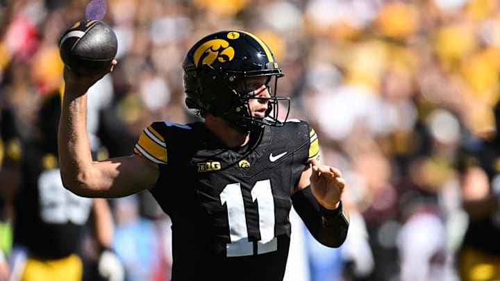 Sep 27, 2025; Iowa City, Iowa, USA; Iowa Hawkeyes quarterback Mark Gronowski (11) throws a pass against the Indiana Hoosiers during the first quarter at Kinnick Stadium. Mandatory Credit: Jeffrey Becker-Imagn Images