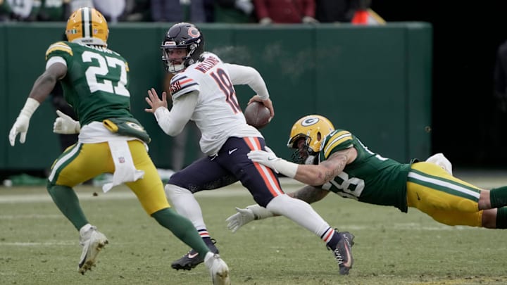 Chicago Bears quarterback Caleb Williams (18) avoids a sack during the fourth quarter of their game Sunday, January 5, 2025 at Lambeau Field in Green Bay, Wisconsin. The Chicago Bears beat the Green Bay Packers 24-22.