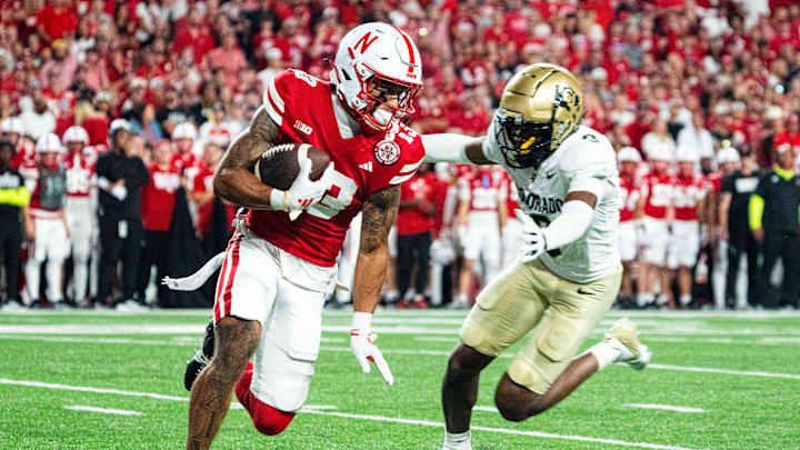 Sep 7, 2024; Lincoln, Nebraska, USA; Nebraska Cornhuskers wide receiver Isaiah Garcia-Castaneda (13) returns a punt against Colorado Buffaloes cornerback Colton Hood (3) during the third quarter at Memorial Stadium. Mandatory Credit: Dylan Widger-Imagn Images Sep 7, 2024; Lincoln, Nebraska, USA; Nebraska Cornhuskers wide receiver Isaiah Garcia-Castaneda (13) returns a punt against Colorado Buffaloes cornerback Colton Hood (3) during the third quarter at Memorial Stadium. Mandatory Credit: Dylan Widger-Imagn Images