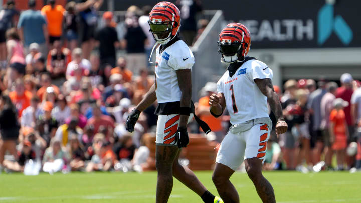 Cincinnati Bengals wide receiver Ja'Marr Chase (1) dances in front of Cincinnati Bengals wide receiver Tee Higgins (5) during NFL training camp practice, Monday, July 31, 2023, in Cincinnati. Cincinnati Bengals wide receiver Ja'Marr Chase (1) dances in front of Cincinnati Bengals wide receiver Tee Higgins (5) during NFL training camp practice, Monday, July 31, 2023, in Cincinnati.