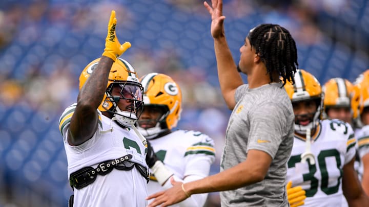 Sep 22, 2024; Nashville, Tennessee, USA;  Green Bay Packers quarterback Jordan Love (10) and running back Josh Jacobs (8) against the Tennessee Titans during pregame warmups at Nissan Stadium. Mandatory Credit: Steve Roberts-Imagn Images