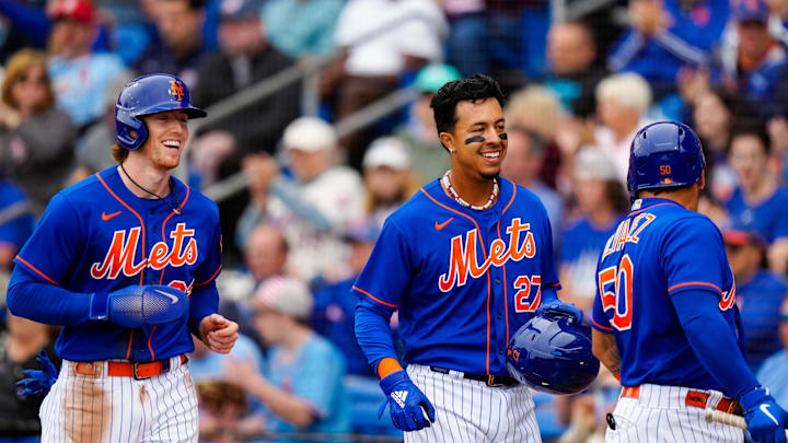 Mar 19, 2023; Port St. Lucie, Florida, USA; New York Mets catcher Francisco Alvarez (50) celebrates with third baseman Brett Baty (22) and first baseman Mark Vientos (27) after they both ran into home against the St. Louis Cardinals during the first inning at Clover Park. Mandatory Credit: Rich Storry-Imagn Images