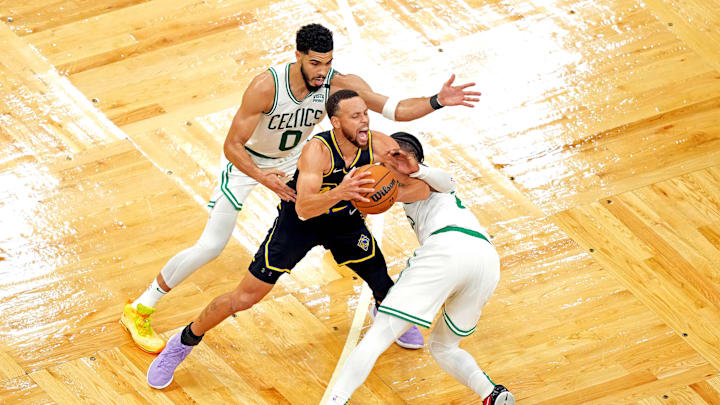 Jun 10, 2022; Boston, Massachusetts, USA; Golden State Warriors guard Stephen Curry (30) handles the ball against Boston Celtics forward Jayson Tatum (0) and guard Jaylen Brown (7) during the second quarter during game four of the 2022 NBA Finals at TD Garden. Mandatory Credit: Kyle Terada-USA TODAY Sports