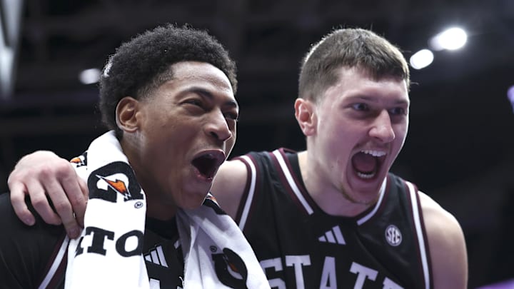 Mississippi State Bulldogs guard Dellquan Warren (left) and forward Sergej MacUra (right) celebrate a win over the Utah Utes after the game at Delta Center. Mississippi State Bulldogs guard Dellquan Warren (left) and forward Sergej MacUra (right) celebrate a win over the Utah Utes after the game at Delta Center.