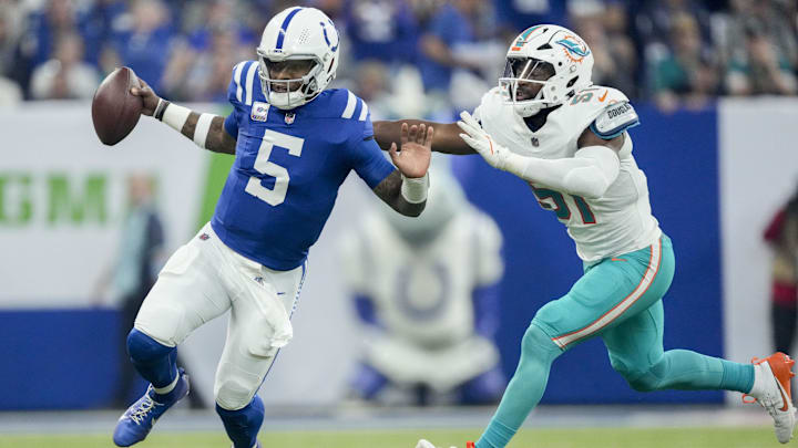 Oct 20, 2024; Indianapolis, Indiana, USA; Miami Dolphins linebacker Tyus Bowser (51) shoves Indianapolis Colts quarterback Anthony Richardson (5) out of bounds Sunday, Oct. 20, 2024, during a game against the Miami Dolphins at Lucas Oil Stadium. Mandatory Credit: Grace Hollars/IndyStar USA TODAY Network via Imagn Images