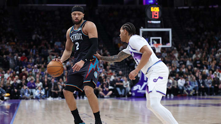 Dec 26, 2025; Salt Lake City, Utah, USA; Detroit Pistons guard Cade Cunningham (2) looks for the play against Utah Jazz guard Keyonte George (3) during the first quarter at Delta Center. Mandatory Credit: Rob Gray-Imagn Images