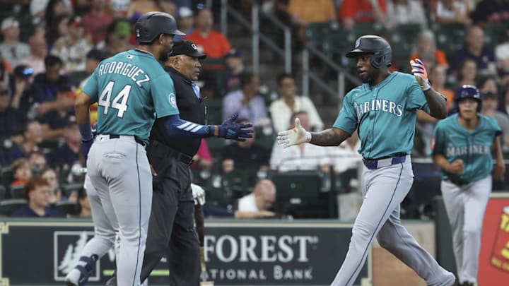 Seattle Mariners left fielder Randy Arozarena (56) celebrates with center fielder Julio Rodriguez (44) after scoring a run during the first inning against the Houston Astros at Daikin Park on April 25. Seattle Mariners left fielder Randy Arozarena (56) celebrates with center fielder Julio Rodriguez (44) after scoring a run during the first inning against the Houston Astros at Daikin Park on April 25.