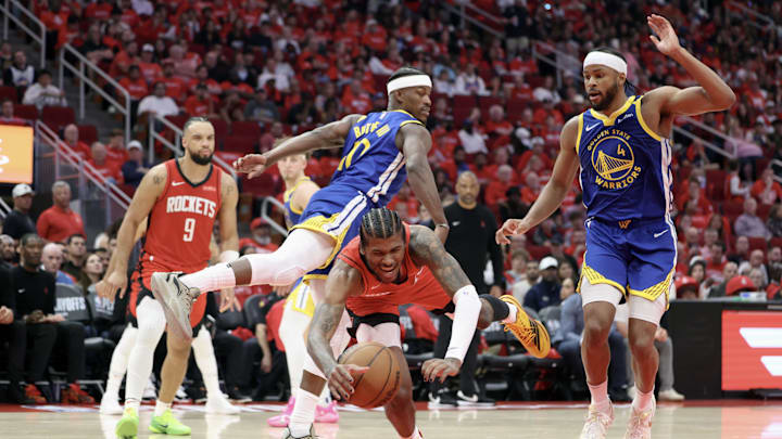 Apr 20, 2025; Houston, Texas, USA; Houston Rockets guard Jalen Green (4) attempts to keep control of the ball during the third quarter against the Golden State Warriors at Toyota Center. Mandatory Credit: Troy Taormina-Imagn Images