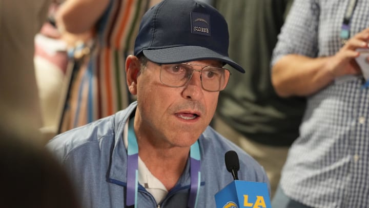 Mar 31, 2025; Palm Beach, FL, USA;  Los Angeles Chargers head coach Jim Harbaugh answers questions during the NFL Annual League Meeting at The Breakers. Mandatory Credit: Jim Rassol-Imagn Images