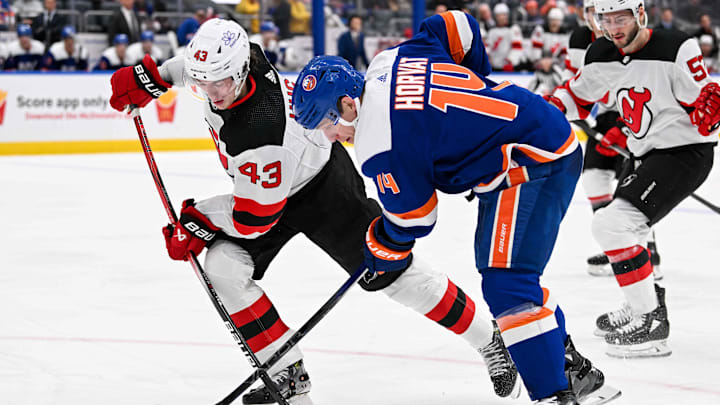 Mar 24, 2024; Elmont, New York, USA; New York Islanders center Bo Horvat (14) and New Jersey Devils Mar 24, 2024; Elmont, New York, USA; New York Islanders center Bo Horvat (14) and New Jersey Devils