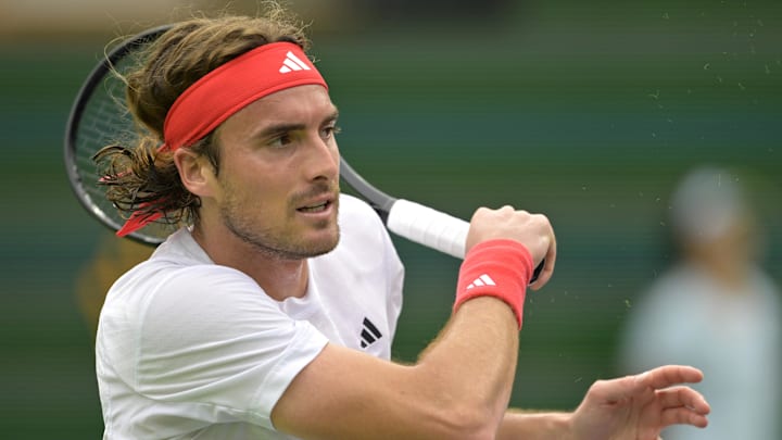 Stefanos Tsitsipas hits a shot