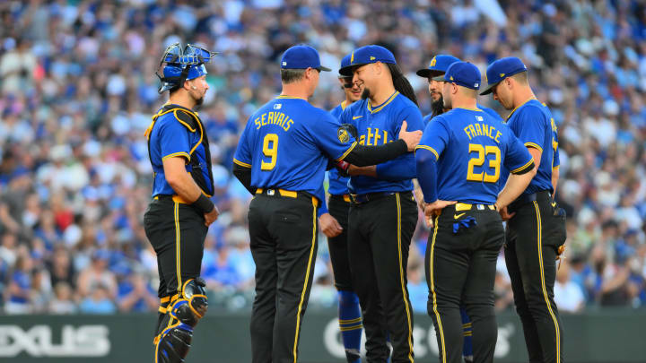 Seattle Mariners manager Scott Servais (9) pulls starting pitcher Luis Castillo (center) from the game during the seventh inning against the Toronto Blue Jays on Friday at T-Mobile Park. Seattle Mariners manager Scott Servais (9) pulls starting pitcher Luis Castillo (center) from the game during the seventh inning against the Toronto Blue Jays on Friday at T-Mobile Park.