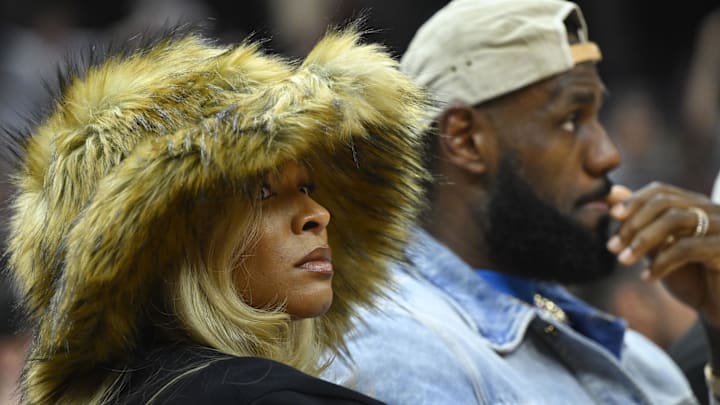 Los Angeles Lakers forward LeBron James and his wife Savannah James watch the game in the second quarter of game four of the second round for the 2024 NBA playoffs between the Cleveland Cavaliers and the Boston Celtics at Rocket Mortgage FieldHouse.