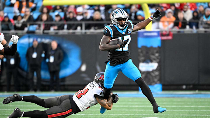 Dec 1, 2024; Charlotte, North Carolina, USA;  Carolina Panthers wide receiver Xavier Legette (17) with the ball as Tampa Bay Buccaneers safety Antoine Winfield Jr. (31) defends in the second quarter at Bank of America Stadium. Mandatory Credit: Bob Donnan-Imagn Images