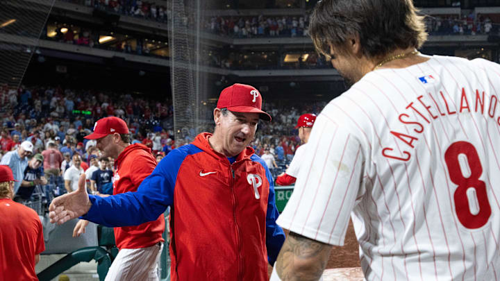 Jun 18, 2024; Philadelphia, Pennsylvania, USA; Philadelphia Phillies manager Rob Thomson congratulates outfielder Nick Castellanos (8) after his walk off RBI double ninth inning against the San Diego Padres at Citizens Bank Park.