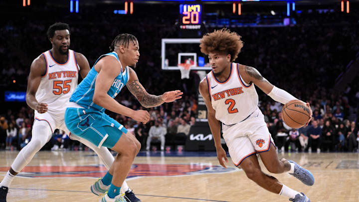 Oct 15, 2024; New York, New York, USA; New York Knicks guard Miles McBride (2) drives to the basket while being defended by Charlotte Hornets forward Keyontae Johnson (7) during the first half at Madison Square Garden. Mandatory Credit: John Jones-Imagn Images