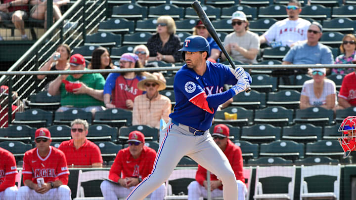 Feb 23, 2026; Tempe, Arizona, USA;  Texas Rangers second baseman Tyler Wade (14) hits a RBI single in the first inning against the Los Angeles Angels during a spring training game at Tempe Diablo Stadium. Mandatory Credit: Matt Kartozian-Imagn Images