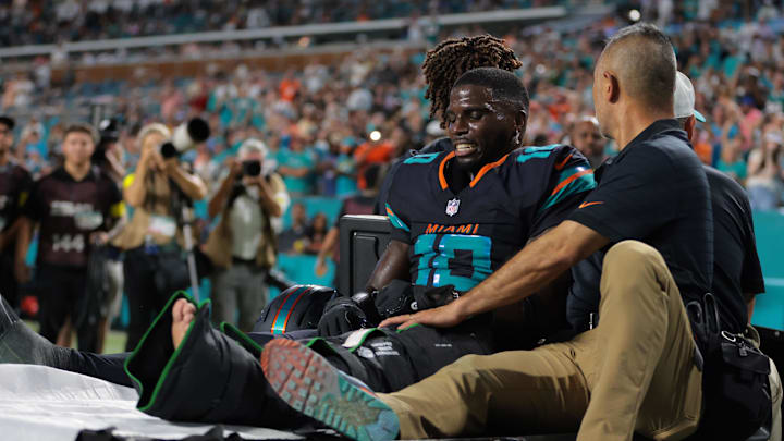 Sep 29, 2025; Miami Gardens, Florida, USA; Miami Dolphins wide receiver Tyreek Hill (10) reacts after being placed on a medical cart against the New York Jets during the second half at Hard Rock Stadium. Mandatory Credit: Sam Navarro-Imagn Images