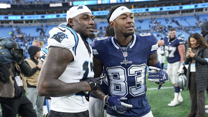Dec 15, 2024; Charlotte, North Carolina, USA; Carolina Panthers wide receiver Xavier Legette (17) and Dallas Cowboys wide receiver Jalen Brooks (83) after a game at Bank of America Stadium. Mandatory Credit: Jim Dedmon-Imagn Images