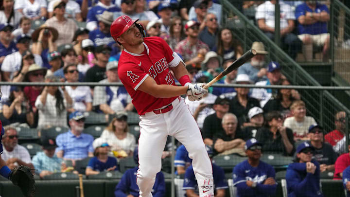 Mar 5, 2025; Tempe, Arizona, USA; Los Angeles Angels outfielder Mike Trout (27) hits a home run against the Los Angeles Dodgers in the first inning at Tempe Diablo Stadium. Mandatory Credit: Rick Scuteri-Imagn Images