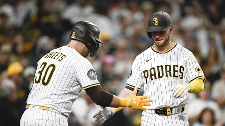 Aug 20, 2025; San Diego, California, USA; San Diego Padres first baseman Ryan O'Hearn (32) is congratulated by Gavin Sheets (30) after hitting a solo home run during the seventh inning against the San Francisco Giants at Petco Park. Mandatory Credit: Denis Poroy-Imagn Images Aug 20, 2025; San Diego, California, USA; San Diego Padres first baseman Ryan O'Hearn (32) is congratulated by Gavin Sheets (30) after hitting a solo home run during the seventh inning against the San Francisco Giants at Petco Park. Mandatory Credit: Denis Poroy-Imagn Images