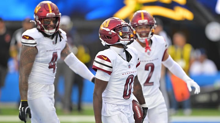 Oct 5, 2025; Inglewood, California, USA; Washington Commanders cornerback Mike Sainristil (0) celebrates after intercepting the ball against the Los Angeles Chargers in the second half at SoFi Stadium. 