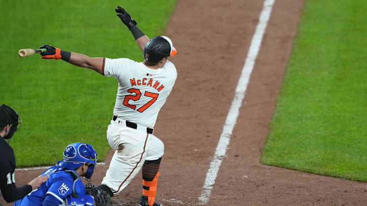 Apr 3, 2024; Baltimore, Maryland, USA; Baltimore Orioles catcher James McCann (27) delivers the game