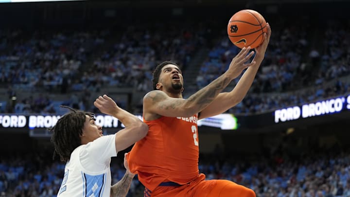 Feb 6, 2024; Chapel Hill, North Carolina, USA;  Clemson Tigers guard Dillon Hunter (2) shoots as North Carolina Tar Heels guard Elliot Cadeau (2) defends in the first half at Dean E. Smith Center. Mandatory Credit: Bob Donnan-Imagn Images