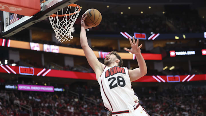 Mar 12, 2025; Houston, Texas, USA; Houston Rockets center Alperen Sengun (28) scores a basket during the third quarter against the Phoenix Suns at Toyota Center. Mandatory Credit: Troy Taormina-Imagn Images