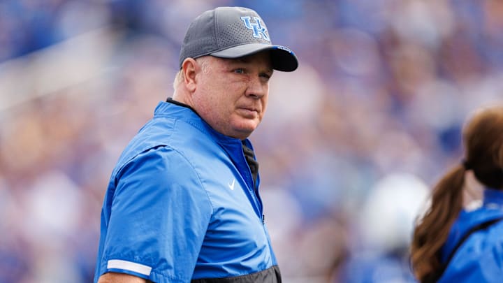 Sep 6, 2025; Lexington, Kentucky, USA; Kentucky Wildcats head coach Mark Stoops walks onto the field before the game against the Mississippi Rebels at Kroger Field. Mandatory Credit: Jordan Prather-Imagn Images