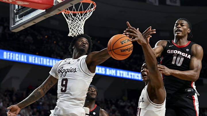 Feb 11, 2025; College Station, Texas, USA; Texas A&M Aggies forward Solomon Washington (9), forward Pharrel Payne (21) and Georgia Bulldogs forward RJ Godfrey (10) battle for the rebound during the first half at Reed Arena. Mandatory Credit: Maria Lysaker-Imagn Images 