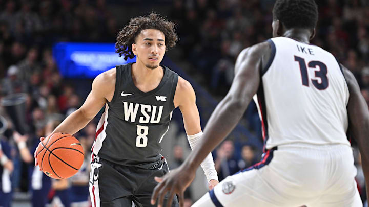 Washington State guard Nate Calmese (8) looks to make a move on Gonzaga forward Graham Ike. Washington State guard Nate Calmese (8) looks to make a move on Gonzaga forward Graham Ike.