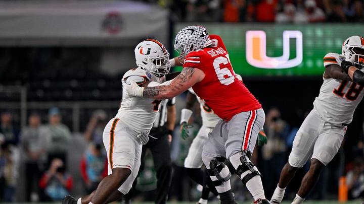 Dec 31, 2025; Arlington, TX, USA; Ohio State Buckeyes offensive lineman Austin Siereveld (67) blocks Miami Hurricanes defensive lineman Rueben Bain Jr. (4) during the 2025 Cotton Bowl and quarterfinal game of the College Football Playoff at AT&T Stadium. Mandatory Credit: Jerome Miron-Imagn Images Dec 31, 2025; Arlington, TX, USA; Ohio State Buckeyes offensive lineman Austin Siereveld (67) blocks Miami Hurricanes defensive lineman Rueben Bain Jr. (4) during the 2025 Cotton Bowl and quarterfinal game of the College Football Playoff at AT&T Stadium. Mandatory Credit: Jerome Miron-Imagn Images