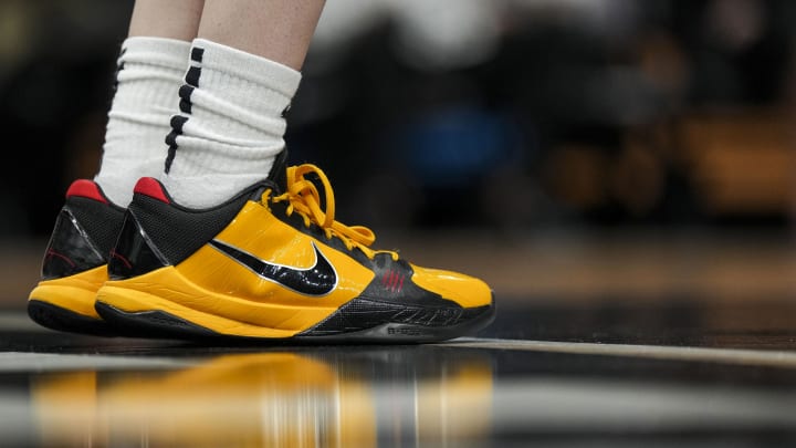 Apr 2, 2023; Dallas, TX, USA; The Nike Kobe 5 Protro Bruce Lee shoes worn by Iowa Hawkeyes guard Caitlin Clark (22) are seen as she stands on the court during warmups prior to the game against the LSU Lady Tigers in the final round of the Women's Final Four NCAA tournament at the American Airlines Center. Mandatory Credit: Kirby Lee-USA TODAY Sports