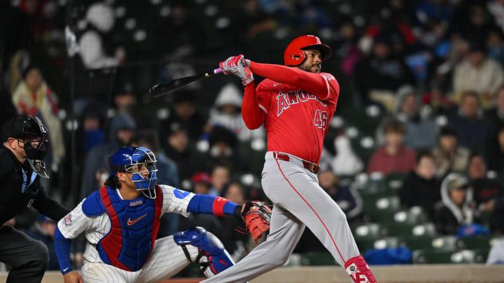 Mar 31, 2026; Chicago, Illinois, USA; Los Angeles Angels third baseman Jeimer Candelario (46) hits a double against the Chicago Cubs during the sixth inning at Wrigley Field. Mandatory Credit: Patrick Gorski-Imagn Images