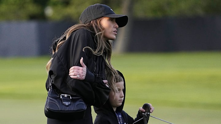 Paulina Gretzky and Tatum Gretzky Johnson, wife and son of Dustin Johnson (not pictured), watch him play during the first round of the PGA Championship golf tournament at Oak Hill Country Club. Paulina Gretzky and Tatum Gretzky Johnson, wife and son of Dustin Johnson (not pictured), watch him play during the first round of the PGA Championship golf tournament at Oak Hill Country Club.