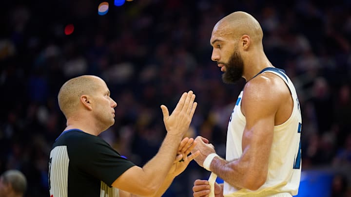 Dec 12, 2025; San Francisco, California, USA; Minnesota Timberwolves center Rudy Gobert (27) talks with referee and crew chief John Goble (10) during the second quarter at Chase Center. Mandatory Credit: Robert Edwards-Imagn Images