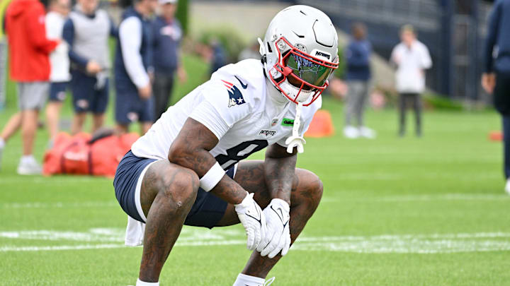 New England Patriots wide receiver Stefon Diggs (8) stretches during minicamp.