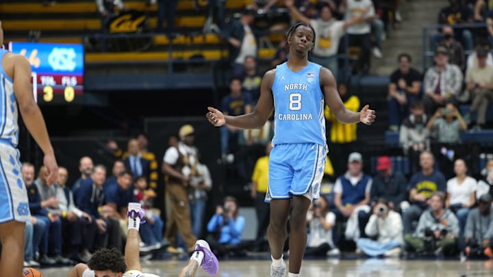 Jan 17, 2026; Berkeley, California, USA; North Carolina Tar Heels forward Caleb Wilson (8) reacts after being called for a foul against California Golden Bears guard Justin Pippen (on ground left) during the second half at Haas Pavilion. Mandatory Credit: Darren Yamashita-Imagn Images