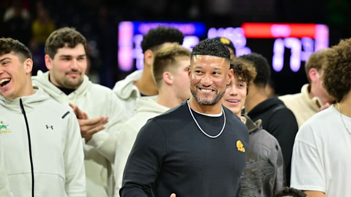 Feb 19, 2025; South Bend, Indiana, USA; Notre Dame head football coach Marcus Freeman and team are honored in the first half of the game between the Notre Dame Fighting Irish and the SMU Mustangs at the Purcell Pavilion. Mandatory Credit: Matt Cashore-Imagn Images