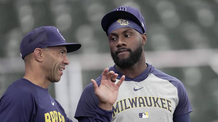 May 10, 2026; Milwaukee, Wisconsin, USA; Milwaukee Brewers first base coach Spencer Allen, left, talks with outfielder Akil Baddoo before their game against the New York Yankees at American Family Field. Mandatory Credit: Mark Hoffman/USA TODAY Network via Imagn Images